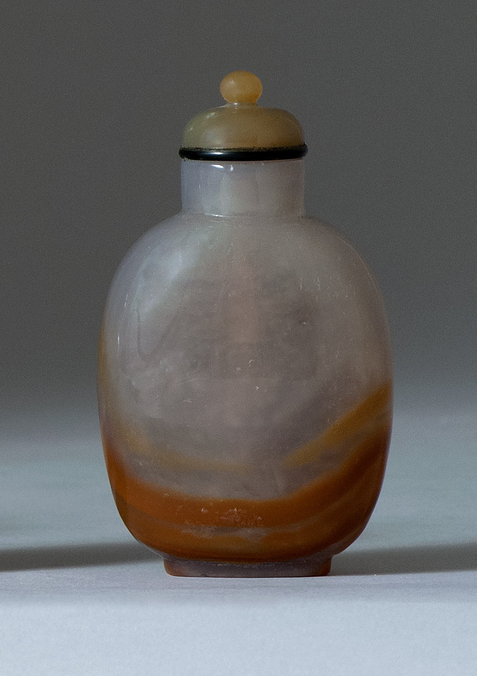 Appraisal: CHALCEDONY FLOATER AGATE SNUFF BOTTLE th CenturyIn elongated ovoid form