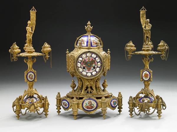 Appraisal: A French gilt bronze and porcelain mounted clock garniture third