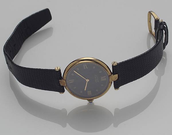 Appraisal: A quartz vermeil wristwatch with a black strap Cartier Must