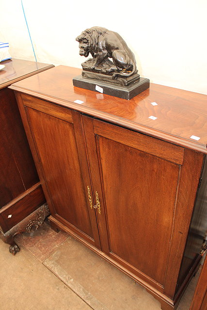 Appraisal: AN EARLY VICTORIAN MAHOGANY BOOKCASE CABINET with two panelled doors