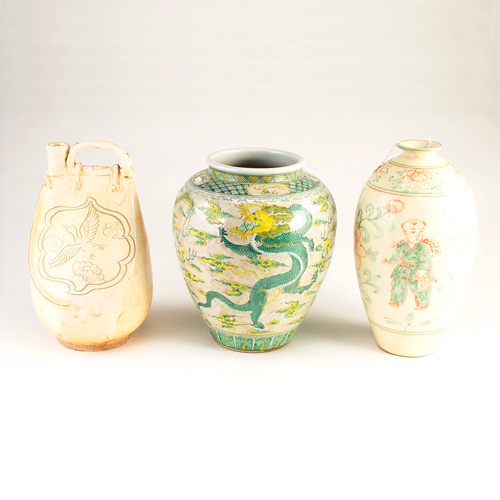 Appraisal: Three Chinese pottery vessels two decorated vases and bottle-form with