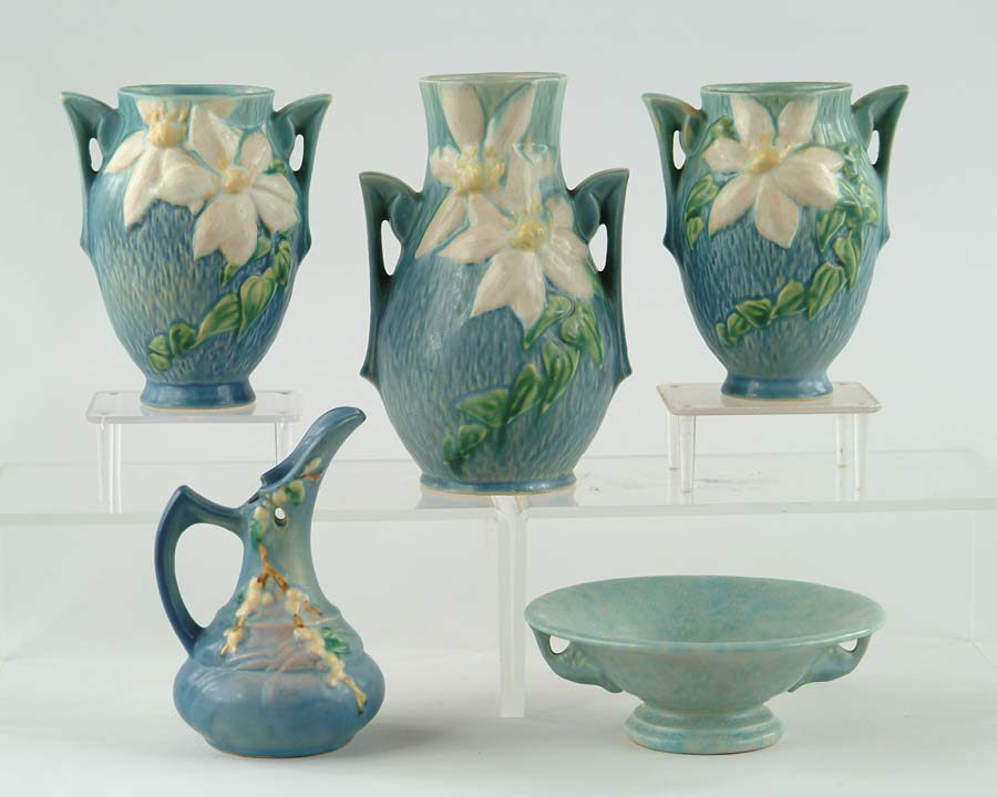 Appraisal: FIVE PIECES OF ROSEVILLE POTTERY Pair of Roseville clematis two