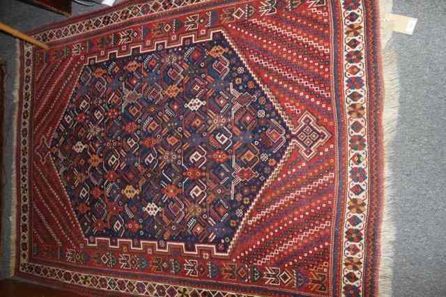 Appraisal: AN ANTIQUE AFSHAR RUG with central blue panel with geometric