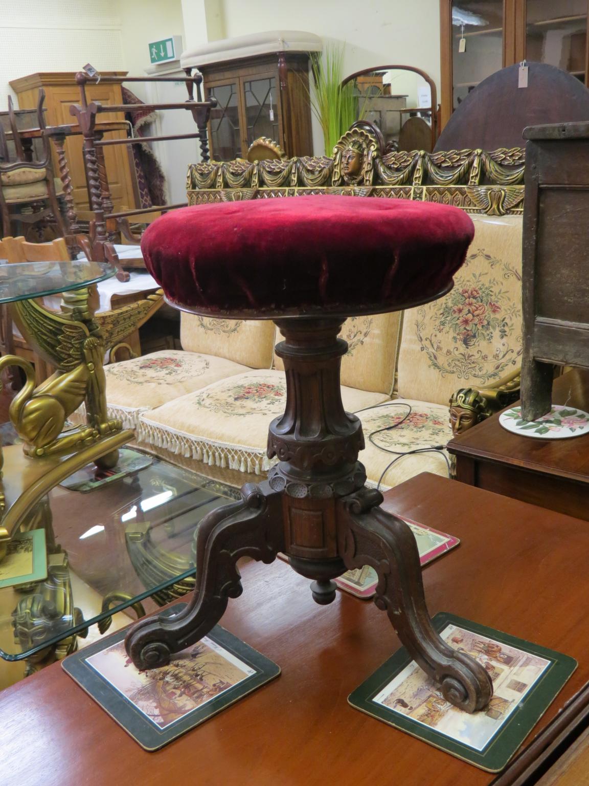 Appraisal: Victorian rosewood piano stool circular upholstered seat adjustable on boldly