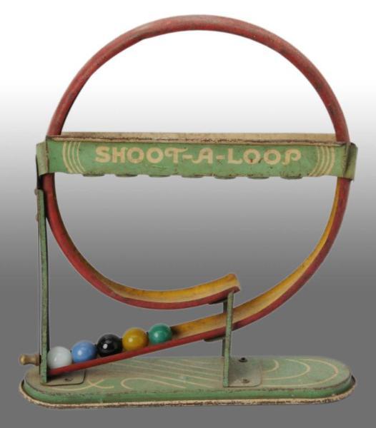 Appraisal: Tin Marble Shoot-A-Loop Toy Description Working Includes five marbles with