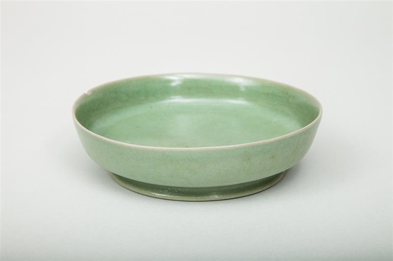 Appraisal: Chinese Celadon-Glazed Shallow Footed Bowl Rim chipped x in Estimate