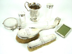 Appraisal: A Victorian silver pedestal christening mug with scroll handle and