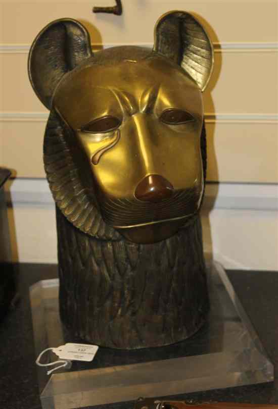 Appraisal: A Syrian style copper mounted brass lion's head on perspex