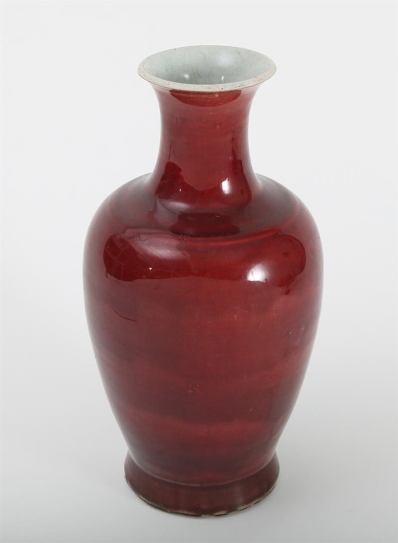 Appraisal: CHINESE OX BLOOD-GLAZED PORCELAIN BALUSTER-FORM VASE Unmarked on hardwood stand