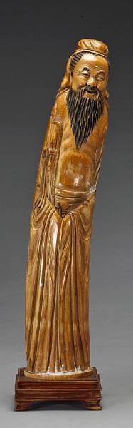 Appraisal: A large stained ivory figure of a scholar th Century