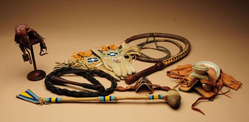 Appraisal: Lot of Pieces Two bullwhips two small model saddles one