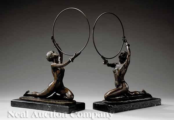 Appraisal: A Pair of Continental Bronze Figures of Hoop Dancers in