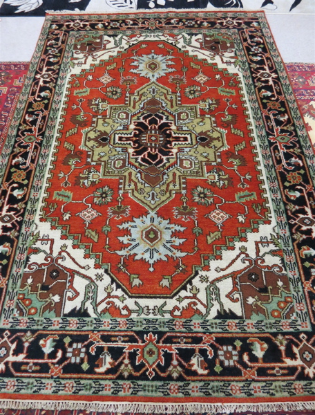 Appraisal: HAND KNOTTED ORIENTAL CARPET Persian Serapi design central geometric medallion