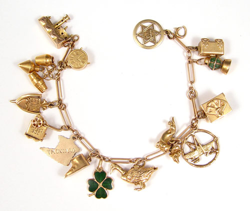 Appraisal: K GOLD CHARM BRACELET WITH CHARMS K yellow gold ''fetter