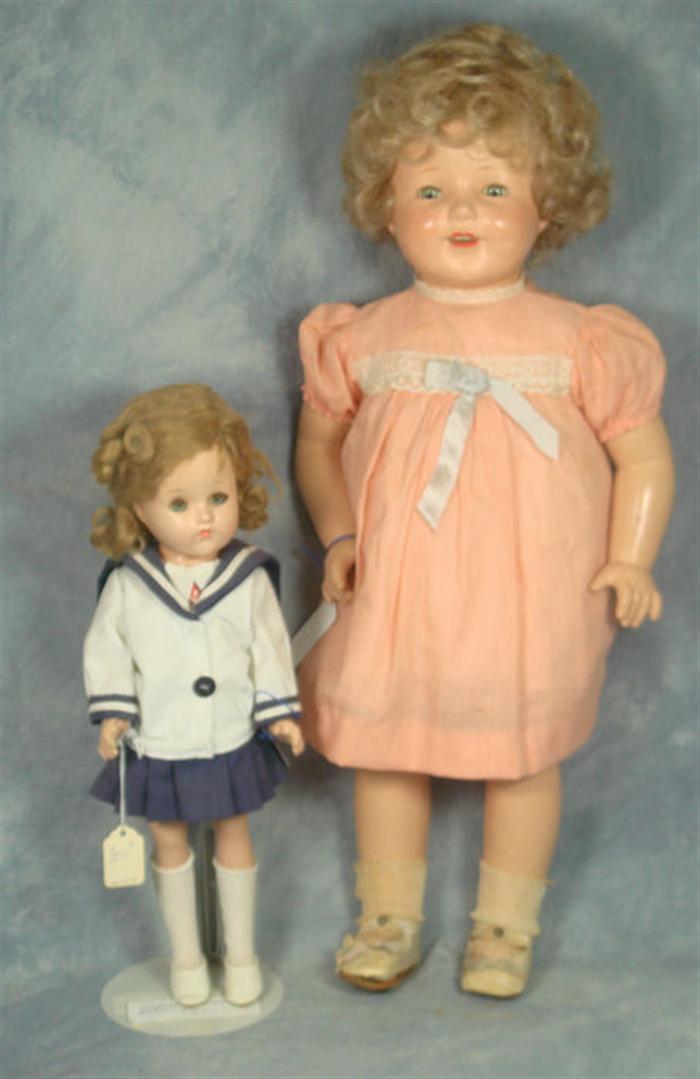 Appraisal: Two Composition Doll the one in the blue and white