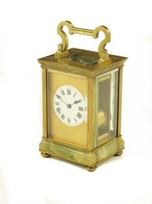 Appraisal: A French gilt brass and onyx mounted carriage clock with