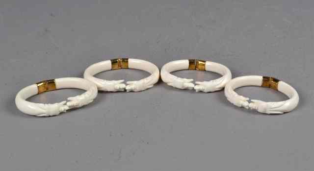 Appraisal: Chinese Ivory BanglesFinely carved to depict elephant heads each with