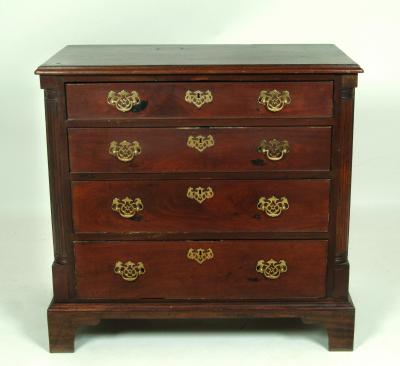 Appraisal: A GEORGE III MAHOGANY CHEST of four graduated drawers with