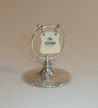 Appraisal: An Edwardian silver bridge counter with circular base rubbed marks