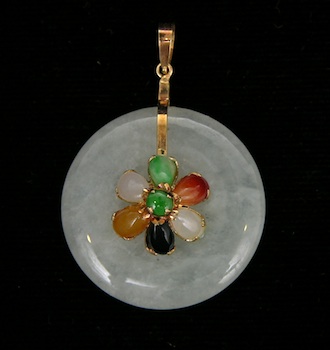 Appraisal: A Small Jade Pendant k yellow gold fittings on a