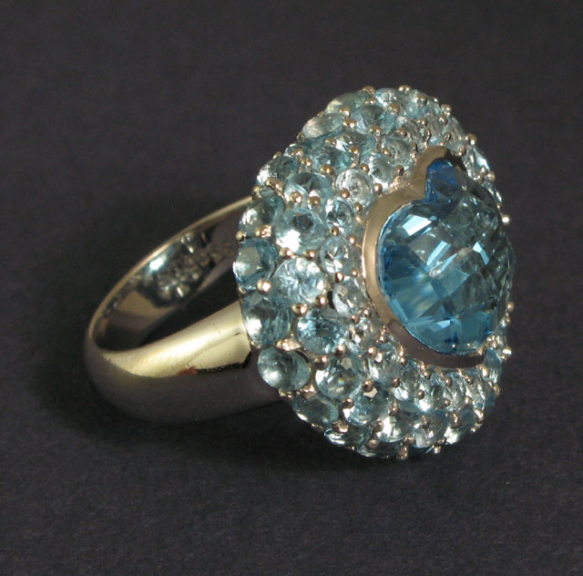 Appraisal: BLUE TOPAZ AND FOURTEEN KARAT GOLD RING centering a heart