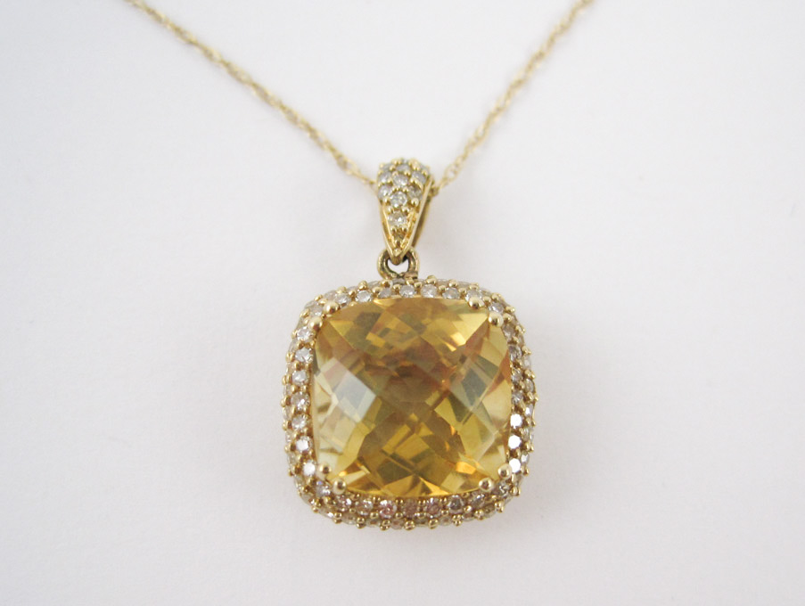 Appraisal: FOURTEEN KARAT GOLD DIAMOND AND CITRINE PENDANT NECKLACE the cushion