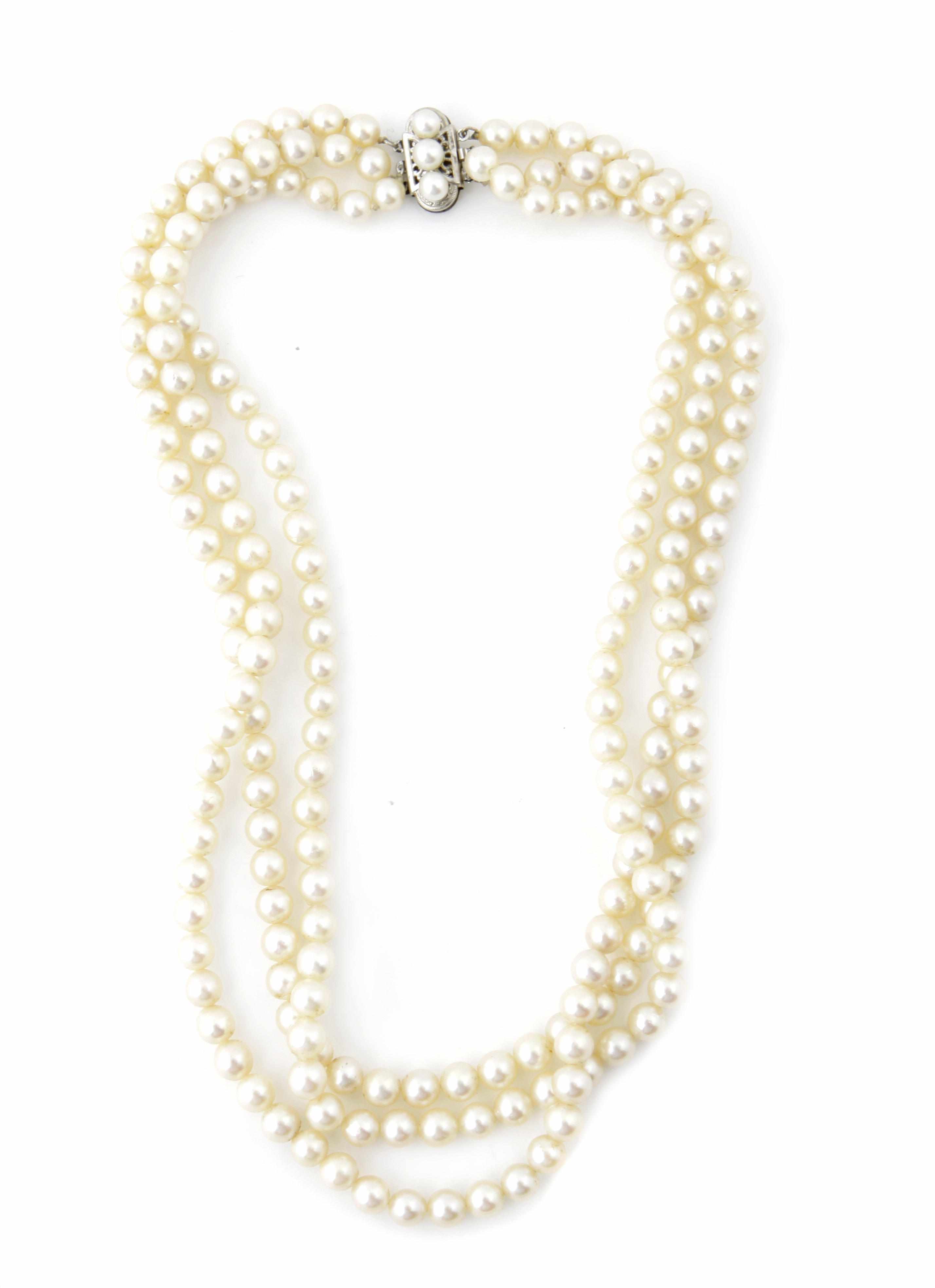 Appraisal: A cultured pearl and k white gold triple strand necklace