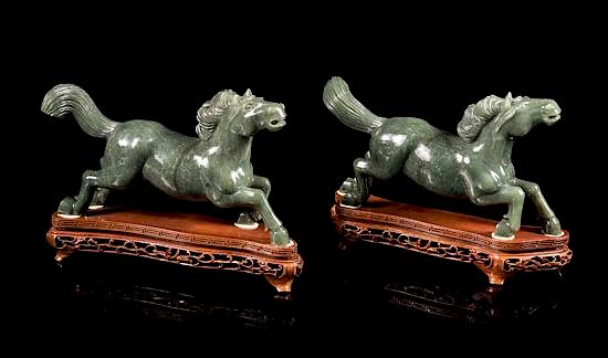 Appraisal: A Pair of Spinach Jade Figures of Horses Length of