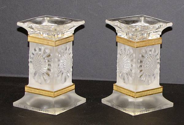 Appraisal: A pair of Lalique glass gilt bronze mounted candlesticks in