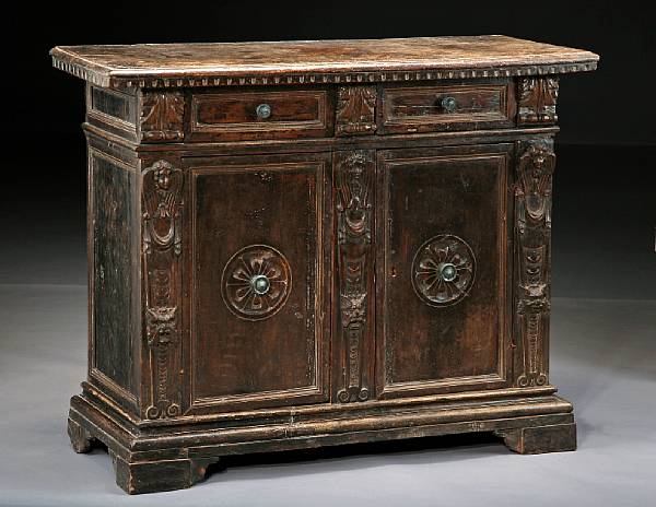 Appraisal: An Italian Baroque walnut credenza The rectangular top over a