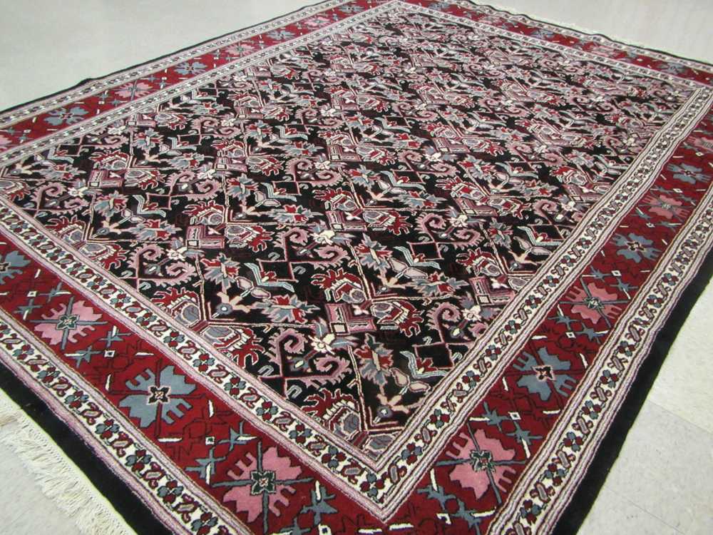 Appraisal: HAND KNOTTED ORIENTAL CARPET Indo-Persian overall repeating stylized floral design