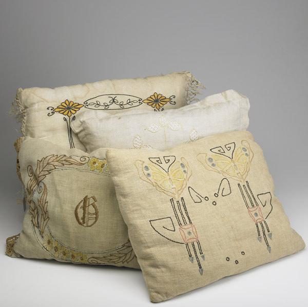 Appraisal: ARTS CRAFTS TEXTILES Four embroidered pillows A few stains