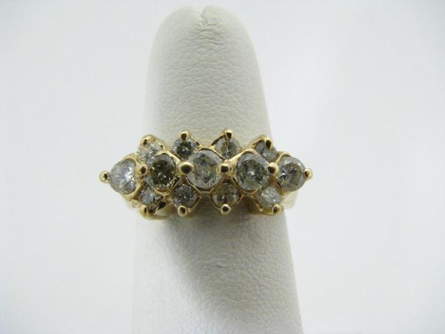 Appraisal: K yellow gold ring with thirteen diamonds approximately ctw dwt