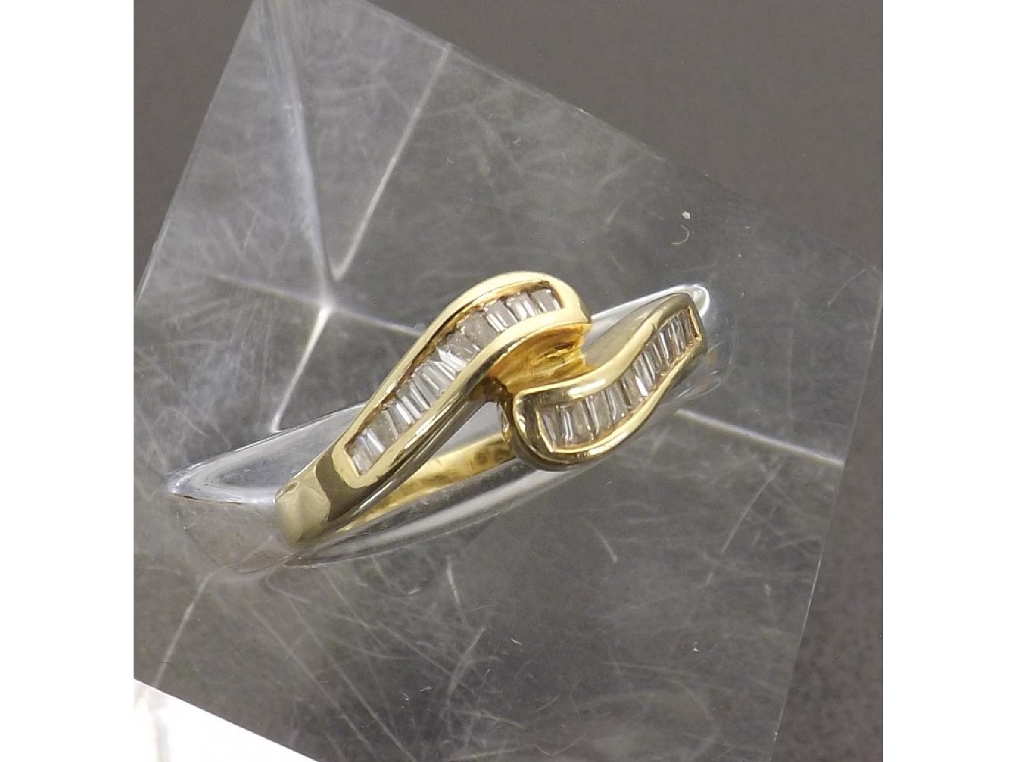 Appraisal: k yellow gold baguette-cut diamond set dress ring ring size