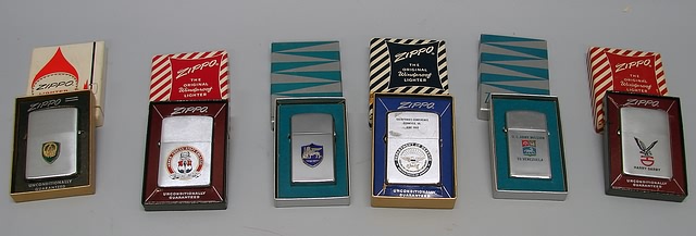 Appraisal: Grouping of six boxed Zippo lighters including designs for Harry