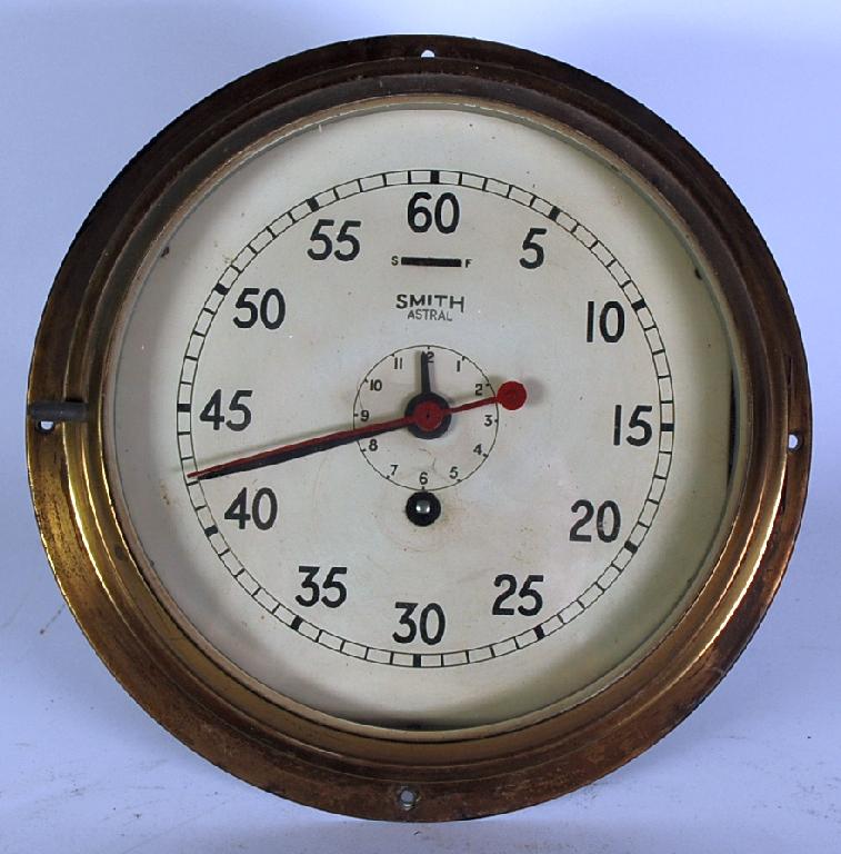 Appraisal: SMITH'S ASTRAGAL BRASS SHIP'S CLOCK the Arabic dial powered by