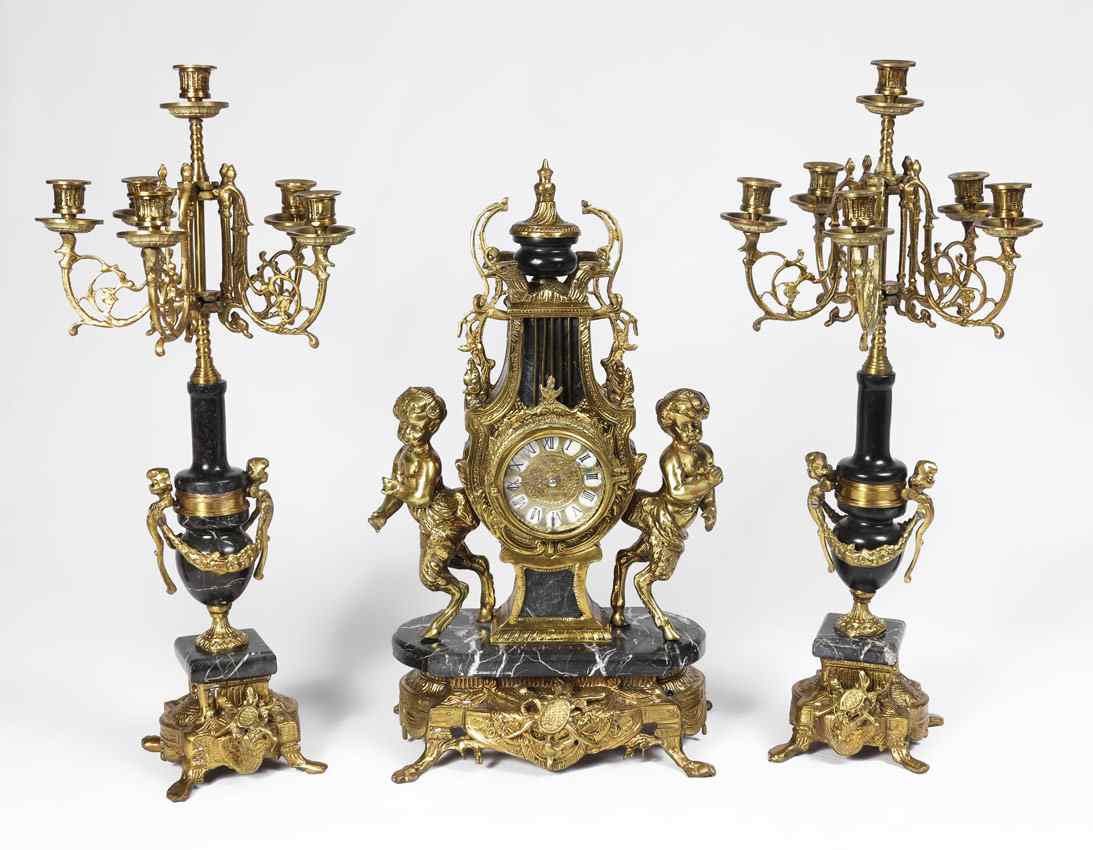 Appraisal: GILT METAL MARBLE FIGURAL CLOCK GARNITURE SET Clock with gilt