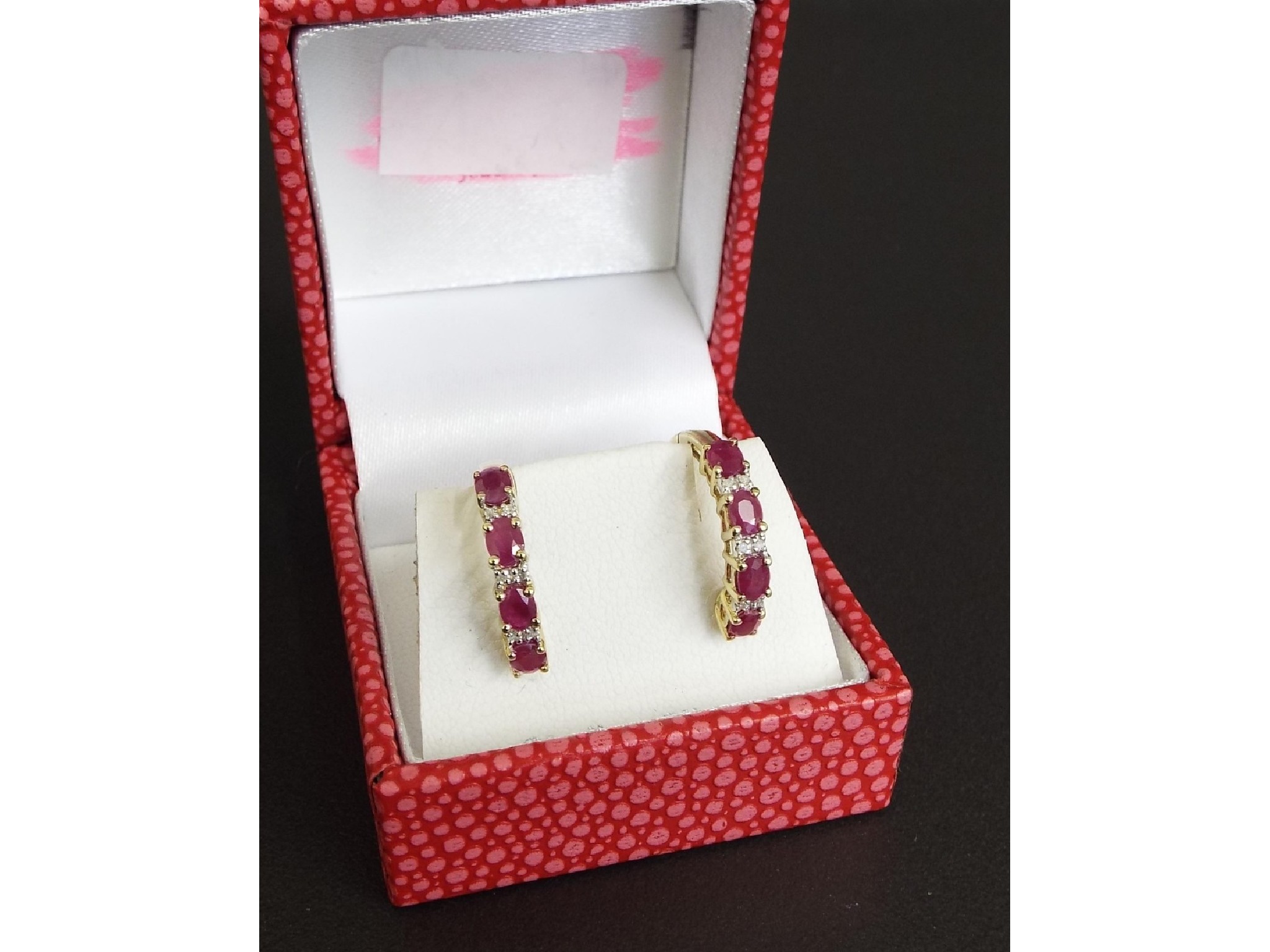 Appraisal: Pair of ruby and diamond ct yellow gold hoop earrings