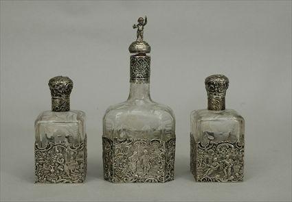 Appraisal: Group of Three Continental Silver-Mounted Bottles