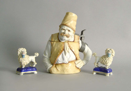 Appraisal: German figural stein h together with a pair of Staffordshire