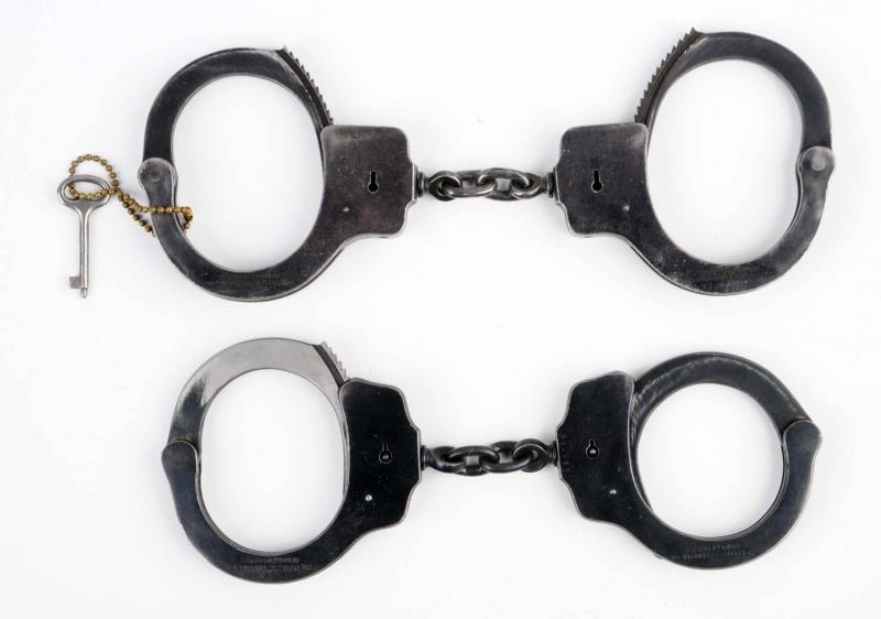 Appraisal: Lot Of Handcuffs First handcuff is a peerless It has