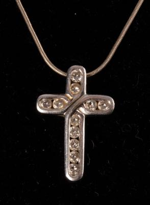 Appraisal: A modern diamond pendant cross set in ct white gold