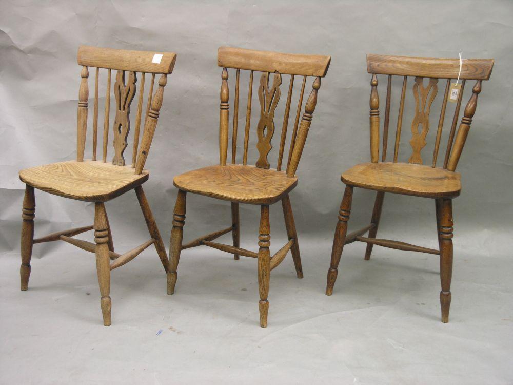 Appraisal: A set of three late Victorian ash Windsor kitchen chairs