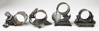 Appraisal: lot of silver plated figural napkin rings incl child putting