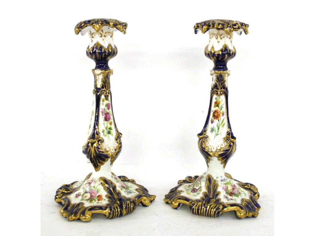 Appraisal: Pair of Staffordshire candlesticks the sconces with wide drip pans