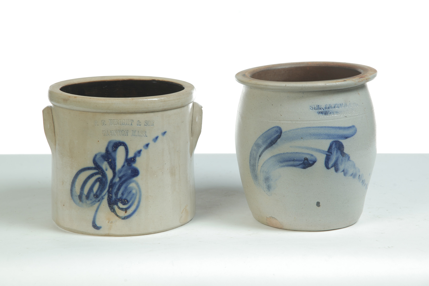 Appraisal: TWO ONE-GALLON STONEWARE JARS WITH COBALT FREEHAND DECORATION American th