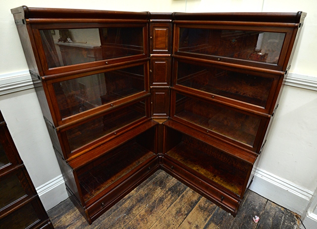 Appraisal: A Globe Wernicke mahogany four tier corner bookcase with glazed