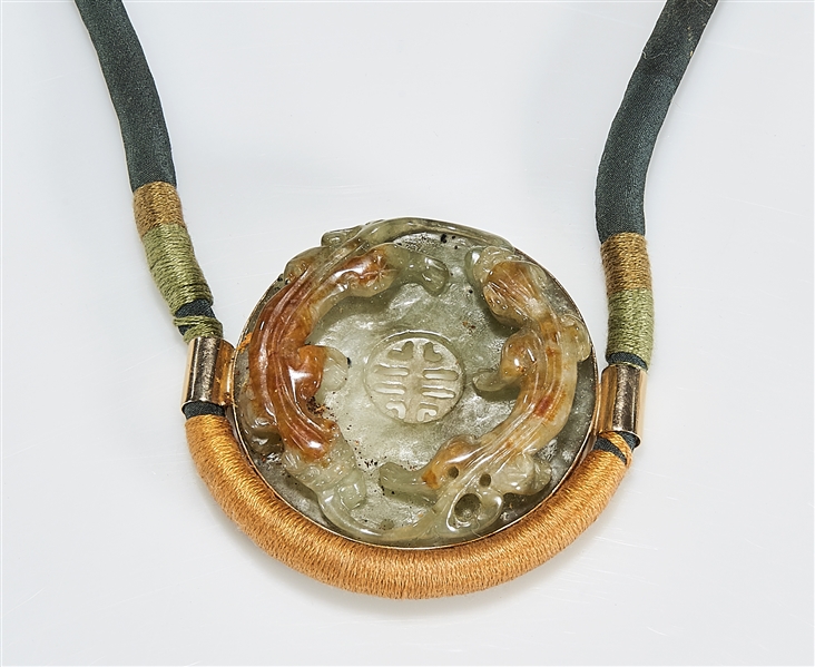 Appraisal: Chinese carved jadeite disc with twin chilong mounted in k