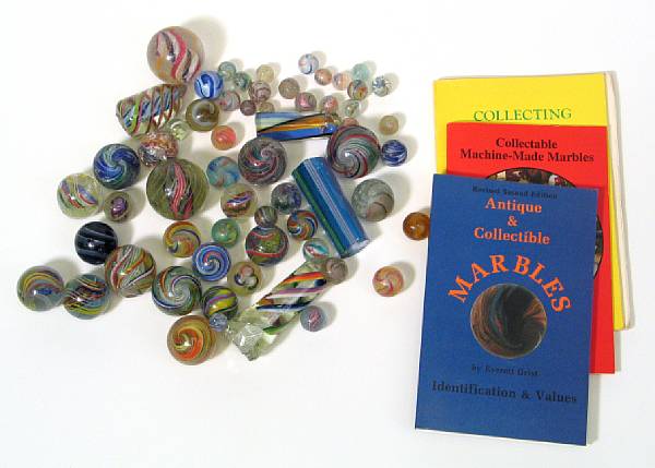 Appraisal: Handmade Marbles Various sized and conditioned marbles including peppermints swirls