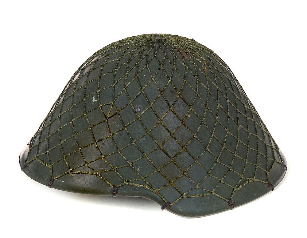 Appraisal: Post-WWI East German Helmet With Netting Original Liner And Chinstrap